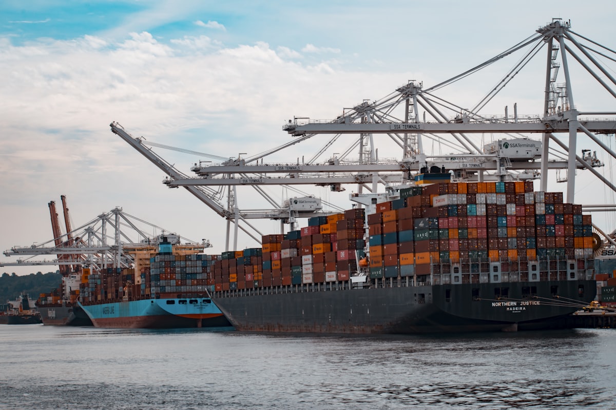 Port cranes loading a container ship